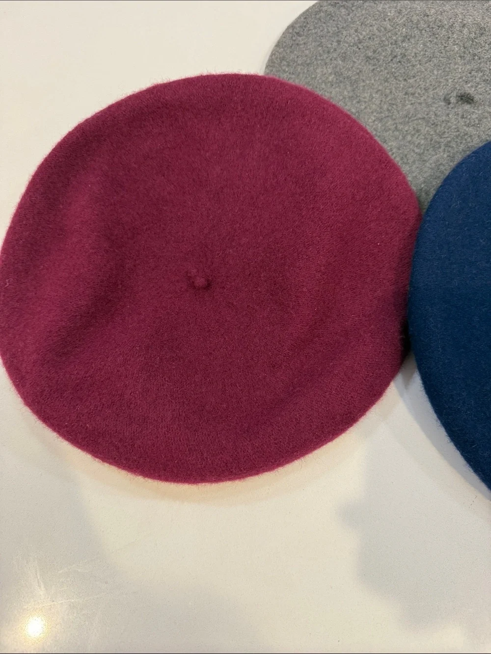 Three Wool Berets in Navy, Burgundy, and Gray